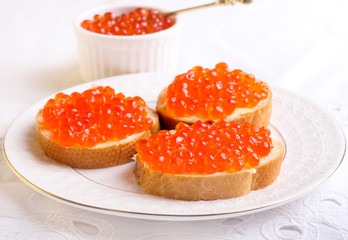 Naklejka na ściany i meble Red caviar on bread