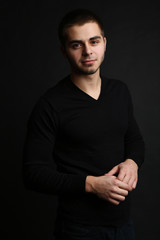 Handsome young man on dark background