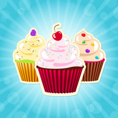 Assorted cupcakes on blue background