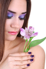 Beautiful young woman with flower isolated on white