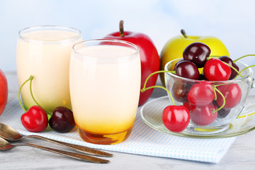 Delicious yogurt with fruits tastes in glasses and fresh fruits