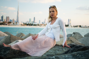 Fototapeta na wymiar Young woman in the beach of Dubai (United Arab Emirates)