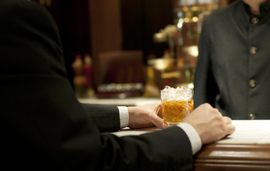 Entrepreneur drinking whiskey at the bar