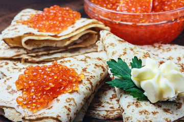 pancakes with red caviar on the table