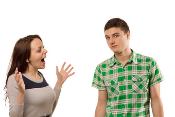 Excited young woman gesturing at her boyfriend