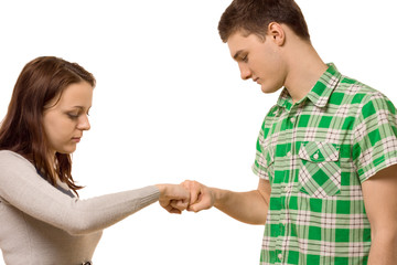 Young couple gently knocking knuckles