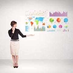 Business woman with colorful graphs and charts