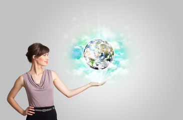 Young woman with earth and cloud concept