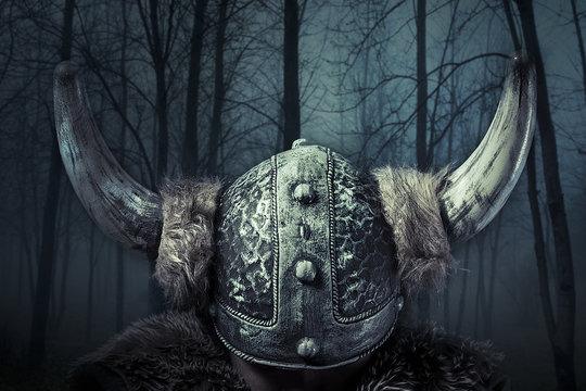 Helmet, Viking warrior, male dressed in Barbarian style with swo
