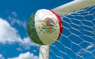 Fototapeta premium Mexican flag and soccer ball in goal net