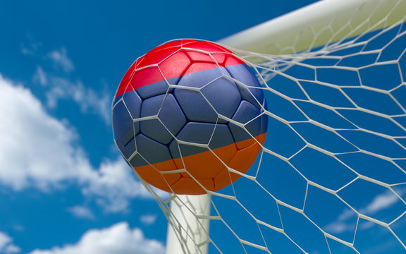 Armenia flag and soccer ball in goal net