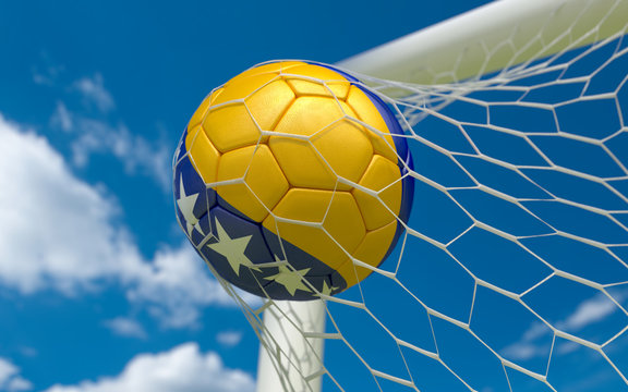 Bosnia flag and soccer ball in goal net