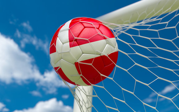 Denmark flag and soccer ball in goal net