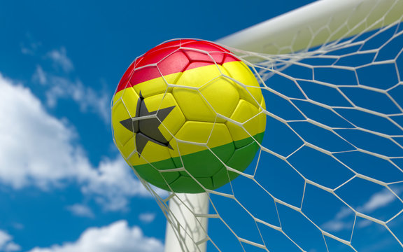 Ghana flag and soccer ball in goal net