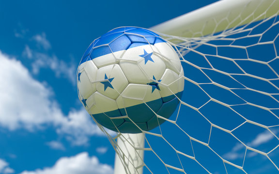 Honduras flag and soccer ball in goal net