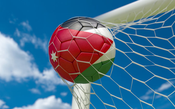 Jordan flag and soccer ball in goal net