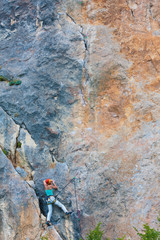 Female climber on a cliff