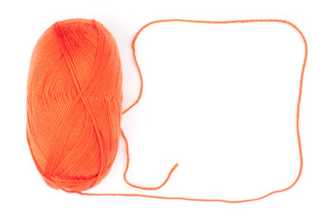 yarn skein of orange color on white background