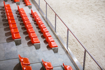 Red sport stadium seats. Empty stand. Team sport supporter