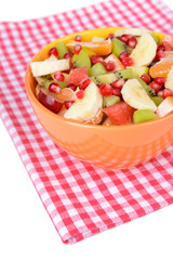 Sweet fresh fruits in bowl on table close-up