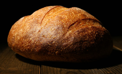 Loaf of bread on dark background