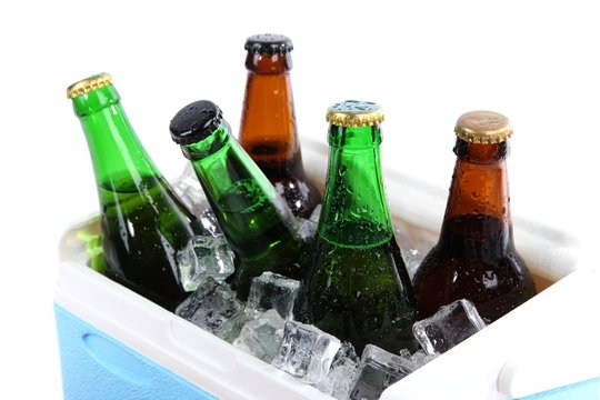 Ice chest full of drinks in bottles, isolated on white
