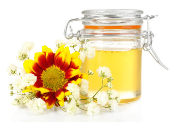 Sweet honey in glass jar isolated on white