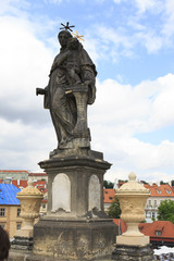 Fototapeta na wymiar Statue of St. Anthony of Padua. Charles Bridge in Prague.