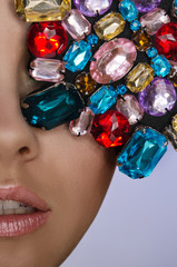 Obraz premium Woman with multicolored stones