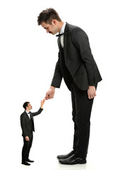 Giant Businessman Shaking Hands With Small Man