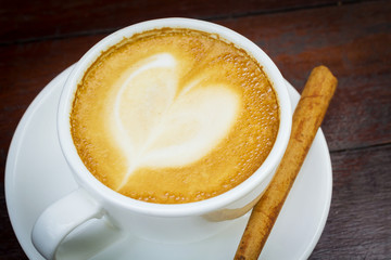 Coffee cup with cinnamon stick