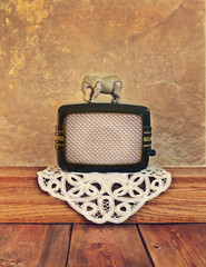 old radio with a toy elephant on the vintage background