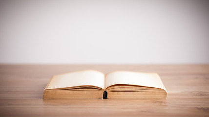 Open book on wooden deck