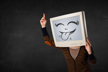 Young girl wearing a monitor with a funny face