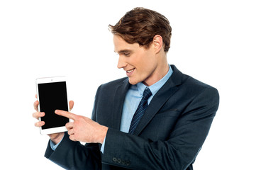 Young business man displaying his new tablet