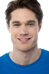 Fototapeta premium Smiling handsome guy isolated over white