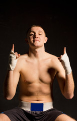 Confident boxer making a derogatory gesture