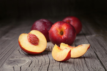 Fototapeta na wymiar Fresh peaches on old table