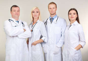 Medical workers on grey background