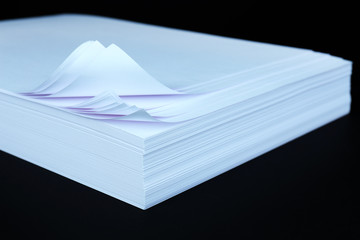 White paper on black background close-up