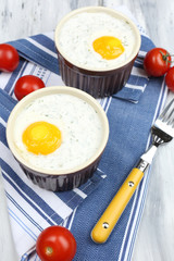 Baked eggs on table close up