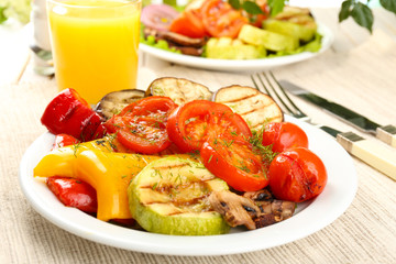 Delicious grilled vegetables on plate on table close-up