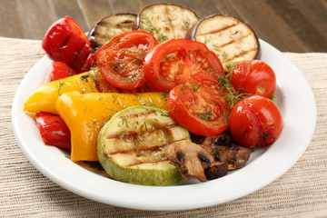 Delicious grilled vegetables on plate on table close-up