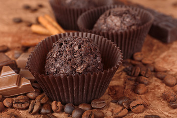 Delicious chocolates on table close-up