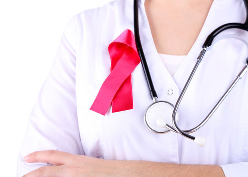 Doctor  with ribbon formed Aids symbol, close-up, isolated