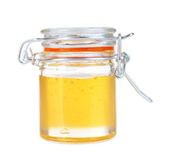 Sweet honey in glass jar isolated on white