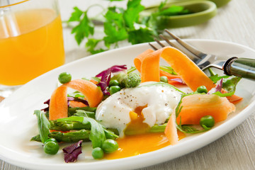 Summer salad with poached egg.