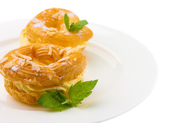 donuts on white plate isolated on white