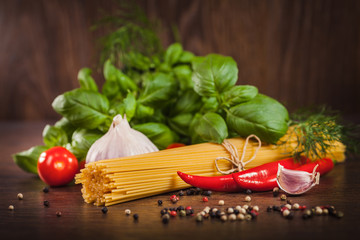 Products on spaghetti bolognese on wood