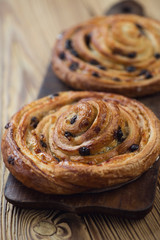Freshly made french sweet buns on a rustic cutting board